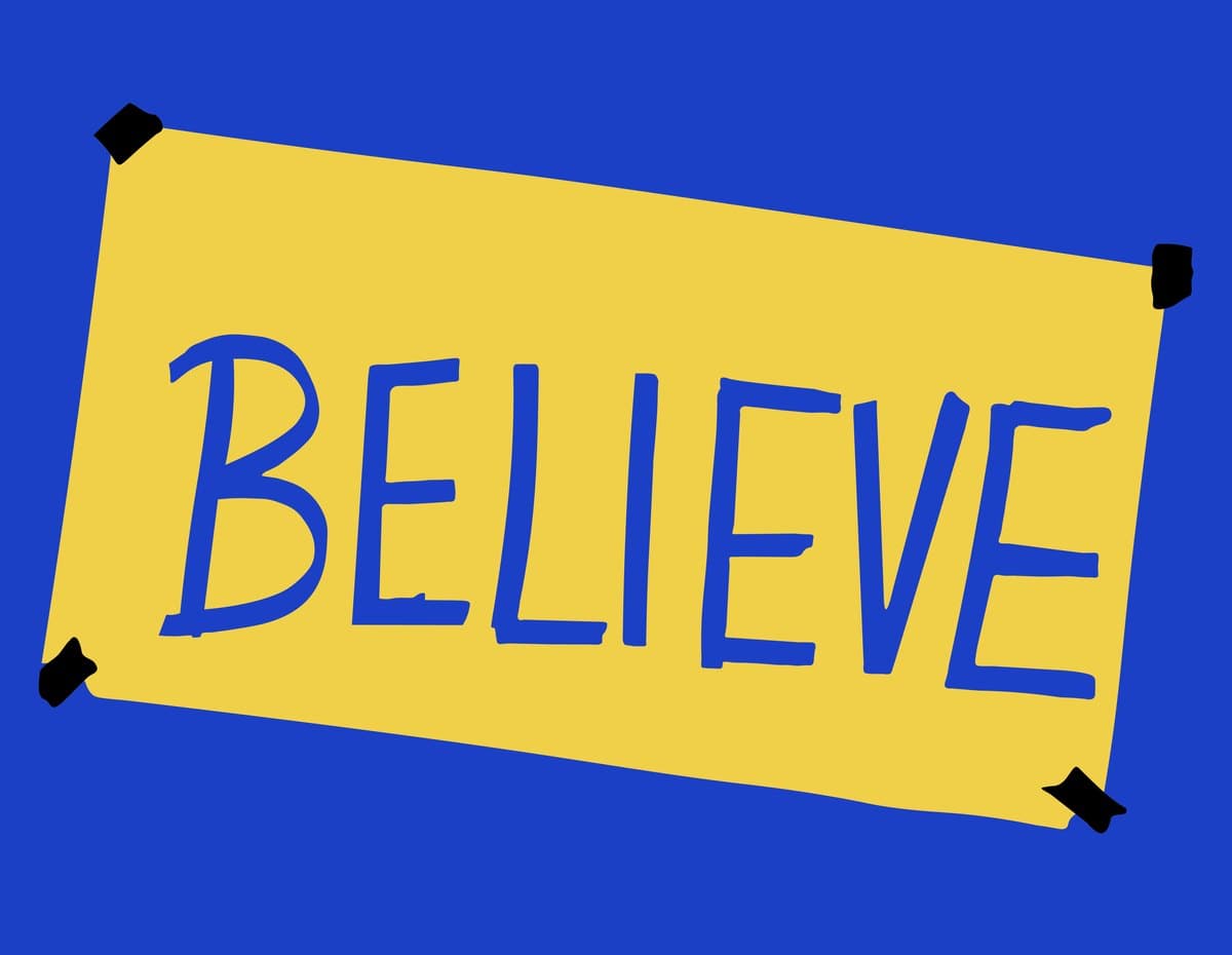 The yellow BELIEVE sign from Ted Lasso, taped to a blue wall